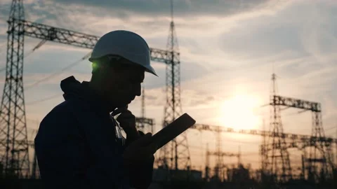 Senior electrical engineer working with tablet near electrical lines. Senior Video stock 150219309