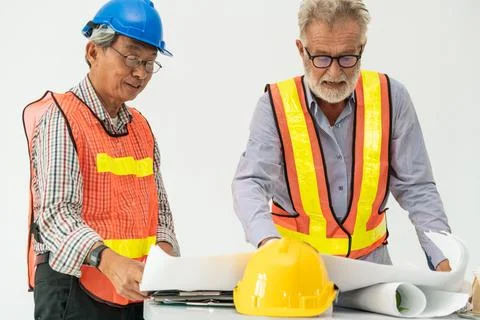 Senior engineer and architect working with drawing Fotos de archivo