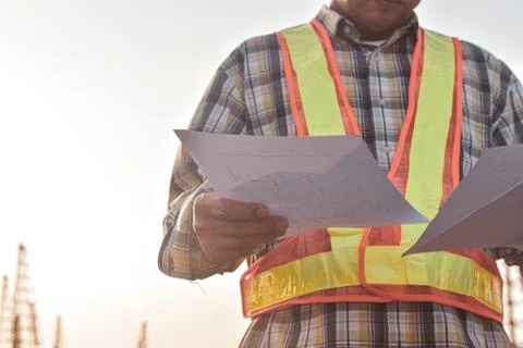 Senior Engineer Checking blueprint construction control management Stock Photos