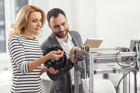 Senior engineer controlling process of filament replacement Stock Photos
