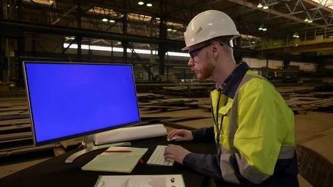 Senior engineer designing on blue mock-up screen computer Stock Footage 106821762
