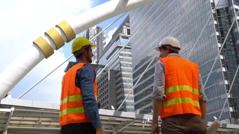 Senior engineer holding arm young worker and they put arm raise to the air w Stock Footage 137444286