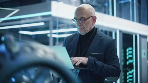 Senior Engineer with Laptop Developing Turbine Engine Video stock 229843336