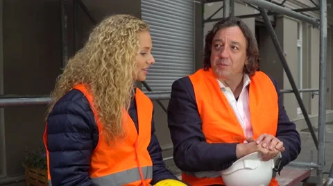 Senior engineer talking with his young and beautiful trainee during work break Stock Footage 68667881