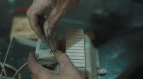 Senior engineer working in garage Stock Footage 66578958