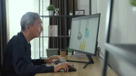 Senior engineer working at home. He showing his 3d robot design. Stock Footage 220325493
