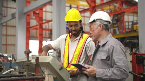 Senior engineers and young man workers are talking Stock Footage 317904698