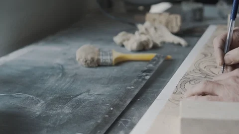 Senior Engraver puts an image on a marble slab using a carbon paper, an ornament 스톡 동영상 99039236