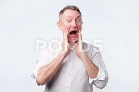 Senior european man in white shirt shout something Stock Photos