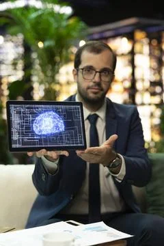 Senior executive pointing at AI interface on tablet Foto stock