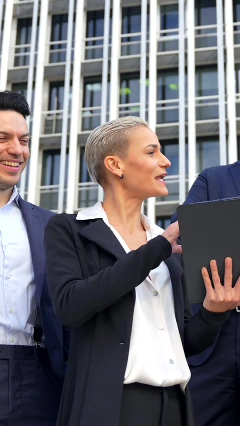Senior Executives Discuss Work Matters with Tablet in Commercial Building Vídeos de archivo 259400353