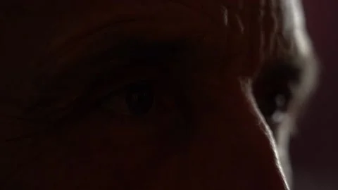 Senior eye close up, reflection in the eyes of TV news Stock Footage 144830857