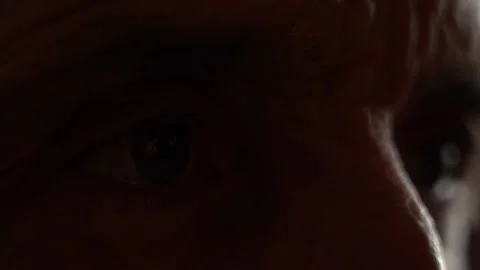 Senior eye close up, reflection in the eyes of TV news Stock Footage 156838474