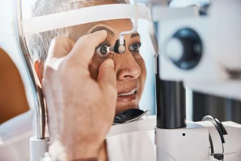 Senior eye zoom, retina check and medical eyes test of elderly woman at doctor Stock Photos