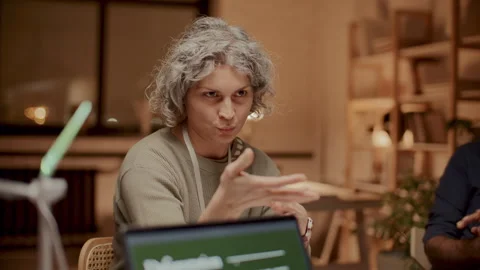 Senior Female Engineer Explaining Her Ideas about Wind Power at Meeting Stock Footage 300230107