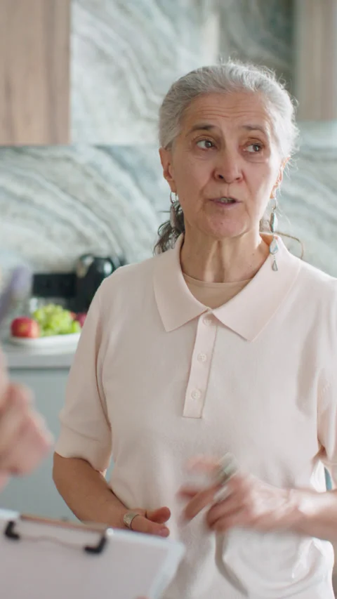 Senior Female Homeowner Explaining Problem to Plumber at Home Stock-Footage 337007962