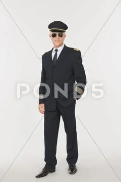 Senior flight captain against white background Stock Photos
