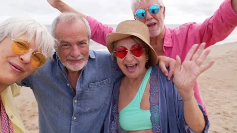Senior friends having fun taking a selfie at the beach Stock Footage 335694684
