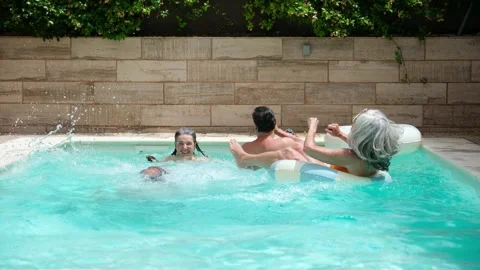 Senior friends having fun taking a selfie in a swimming pool Stock Footage 337658876
