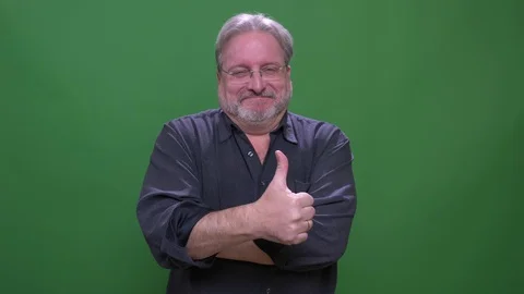 Senior gray haired american manin glasses puts thumb-up to show respect isolated Video stock 108683081