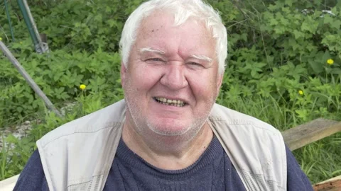 Senior gray-haired man looking at camera and smiling. Stock Footage 157287499