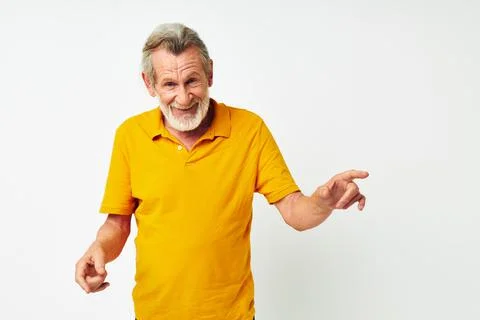 Senior grey-haired man with a gray beard emotion gestures hands cropped view Stock Photos