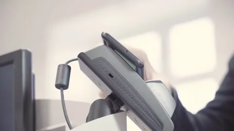 Senior hand pays on a payment machine with a smartphone in a supermarket Stock Footage 155530809