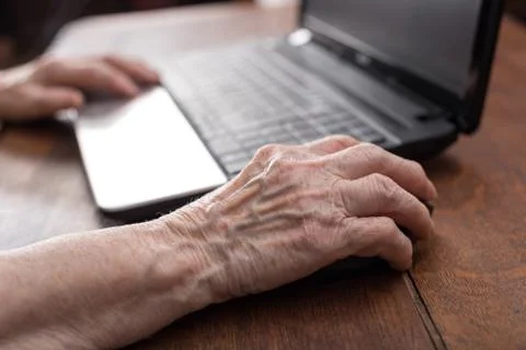 Senior hand using the mouse of a computer Stock Photos