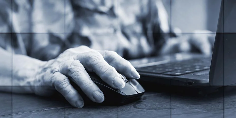 Senior hand using the mouse of a computer, geometric pattern Stock Photos