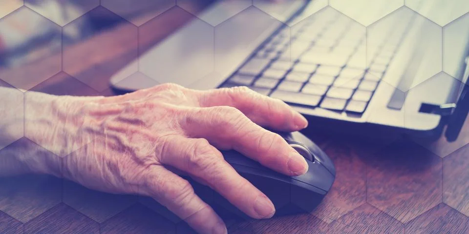 Senior hand using the mouse of a computer, geometric pattern Stock Photos