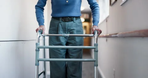 Senior, hands or hallway with walker in retirement apartment for mobility or 스톡 동영상 340743926