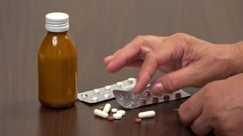 Senior hands sorting medications, choose the pills  Stock Footage 46216592