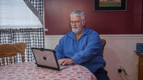 Senior Happy Using a Computer and Technology Stock Photos