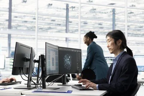 Senior hardware developer in semiconductor facility designing microchip Stock Photos