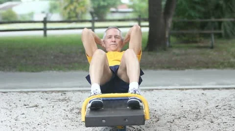Senior healthy man doing sit-ups in park 스톡 동영상 20567231
