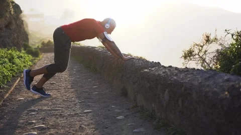 Senior hipster man doing stretching exercises outdoor Stock Footage 137440657