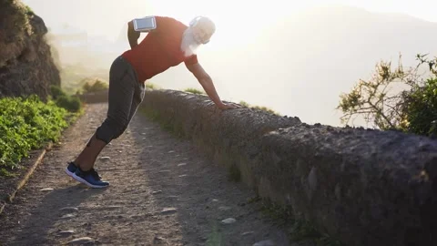 Senior hipster man doing stretching exercises outdoor Stock Footage 137440659