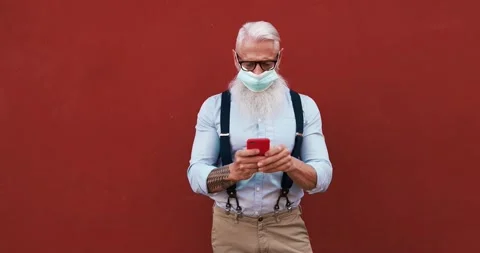 Senior hipster man using mobile phone Stock Footage 149117338
