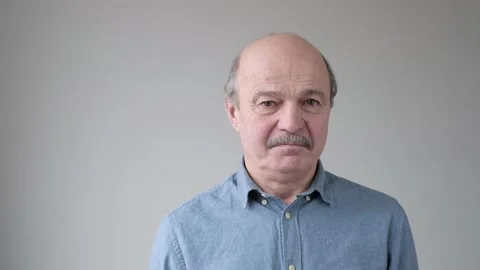 Senior hispanic father looking unsatisfied and tired being dissapointed with his Stock Footage 120176444