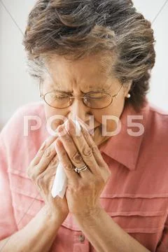 Senior Hispanic woman sneezing Stock Photos