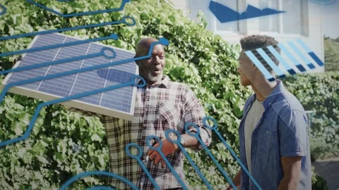 Senior installer raising solar panel and teaching trainee, blue circuitry 動画素材 333894511