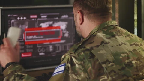 Senior Israeli serviceman responding to cyberattack during military operation Stock Footage 335538756