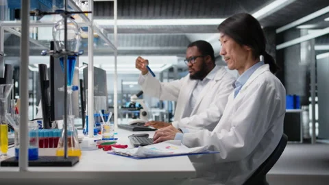 Senior lab engineer using computer application for DNA data analysis Stock Footage 320143747