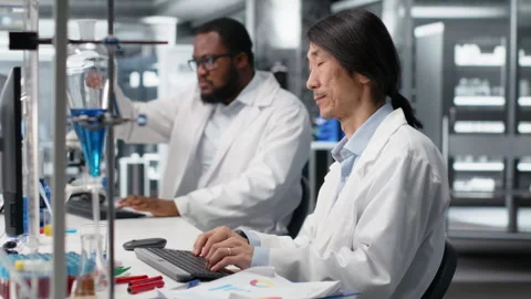 Senior lab engineer using computer application for DNA data analysis Stock Footage 320721993