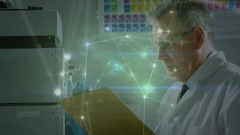 Senior lab tech reading clipboard, operating analyzer, verifying samples with Stock Footage 330602265