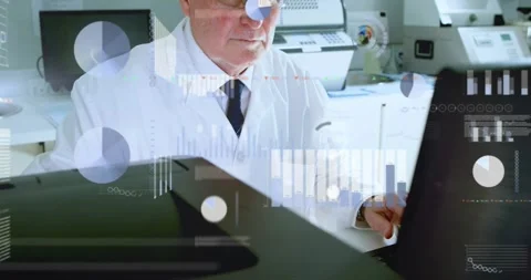 Senior lab tech typing, initiating data charts over monitor, removing glasses Stock Footage 334182330