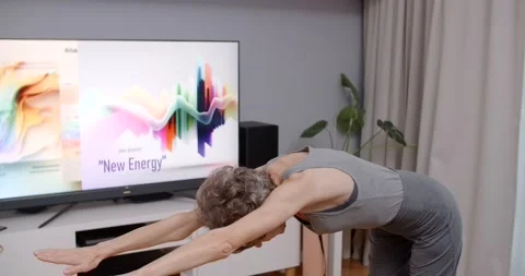 Senior lady is doing energizing workouts and exercises at home, fitness training Stock Footage 231797587