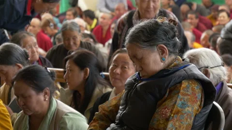 Senior lady has fallen asleep during Dalai Lama speech Stock Footage 48779003