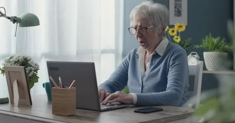 Senior lady having problems with her computer 動画素材 151211381