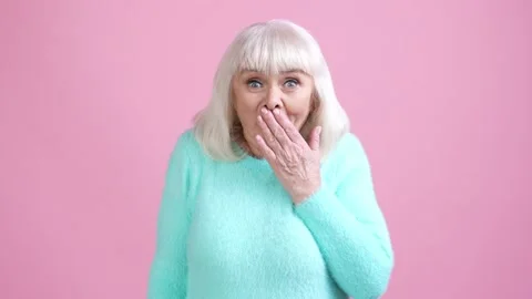 Senior lady impressed rumor gift isolated pastel color background Stock Footage 169288958